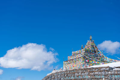 Low angle view of temple against blue sky