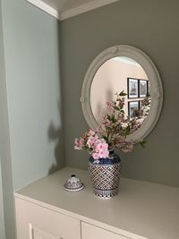 Flower vase on table at home