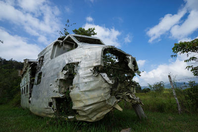 Old ruin on field against sky