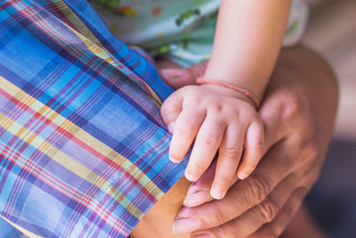 Close-up of woman holding hands