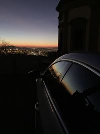 Close-up of silhouette car on road against sky during sunset