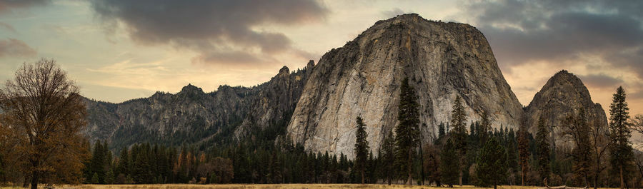 Panoramic view of rocks against sky during sunset