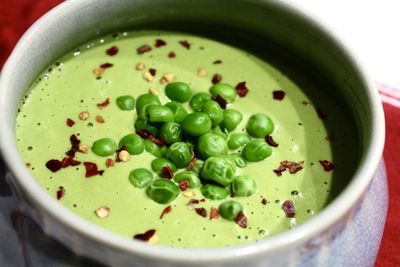 High angle view of pea soup in container on table