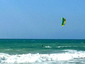 Scenic view of sea against blue sky