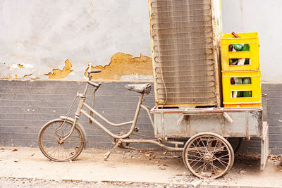 Delivery vehicle. tricycle. tired. dirty.