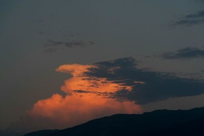 Low angle view of silhouette mountain against sky during sunset