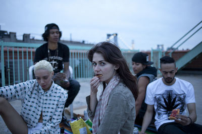 Friends hanging out on a building rooftop