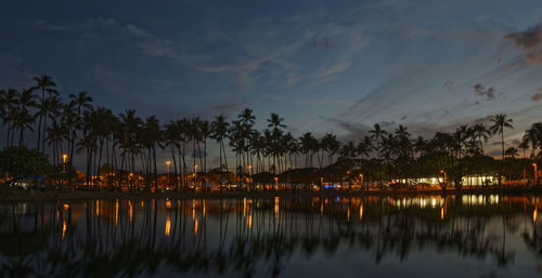 Scenic view of lake against sky at night