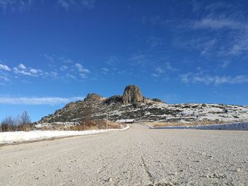 Scenic view of sand against sky