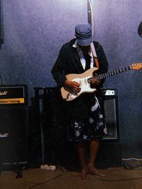 High angle view of man holding guitar