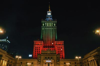 Low angle view of illuminated buildings at night