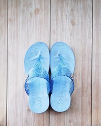 High angle view of shoes on wooden table