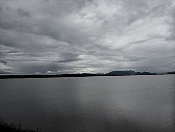 Scenic view of sea against cloudy sky