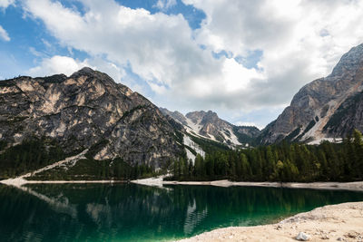 Scenic view of lake and mountains against sky