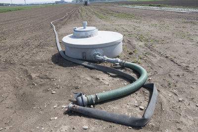 High angle view of pipe on field