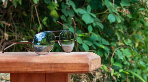 Close-up of glasses on bench