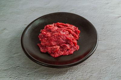 High angle view of red cake in plate