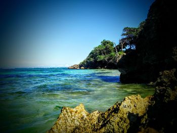 Scenic view of sea against clear sky