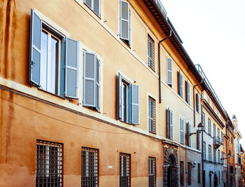 Low angle view of residential building against clear sky