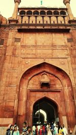 Group of people in front of historical building
