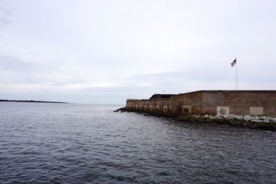 View of buildings by sea