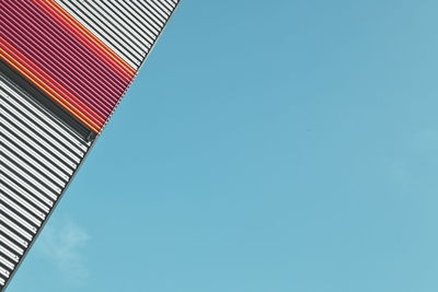 Low angle view of building against clear blue sky