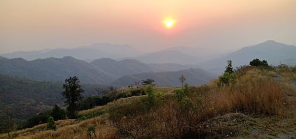 Scenic view of mountains against sky during sunset