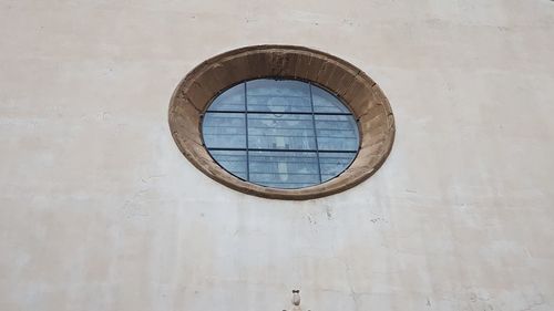 Low angle view of window on wall