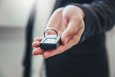 Close-up of man using mobile phone