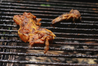 Close-up of meat on barbecue grill