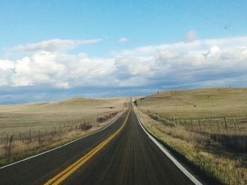 Country road passing through landscape