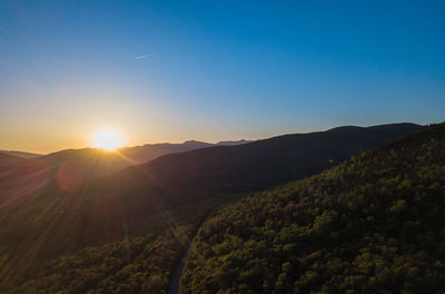 Scenic view of mountains against sky during sunset