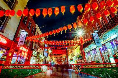 Low angle view of illuminated building at night