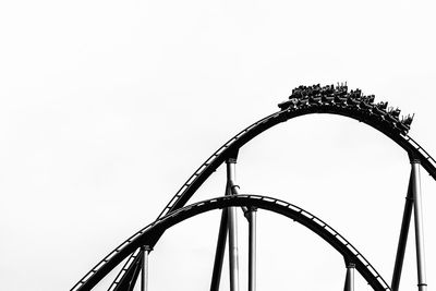 Low angle view of rollercoaster against sky