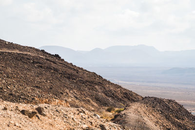 Scenic view of rocky mountains against sky in lanzarote 