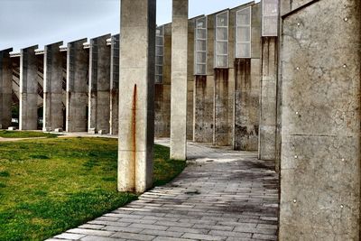 Corridor of historic building against sky