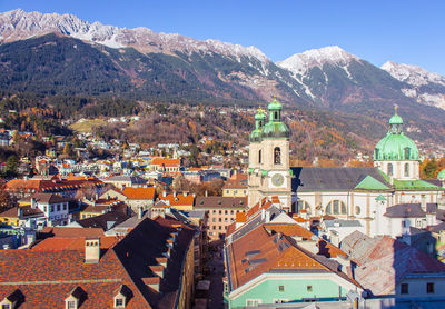 High angle view of townscape and mountains against sky, innsbruck, austria.