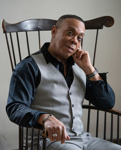 Portrait of smiling man sitting on chair