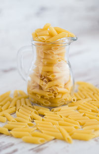 Close-up of yellow glass on table