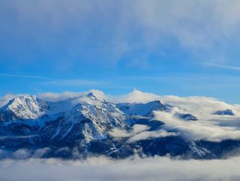 Scenic view of snowcapped mountains against sky