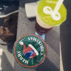 High angle view of drink with text on road