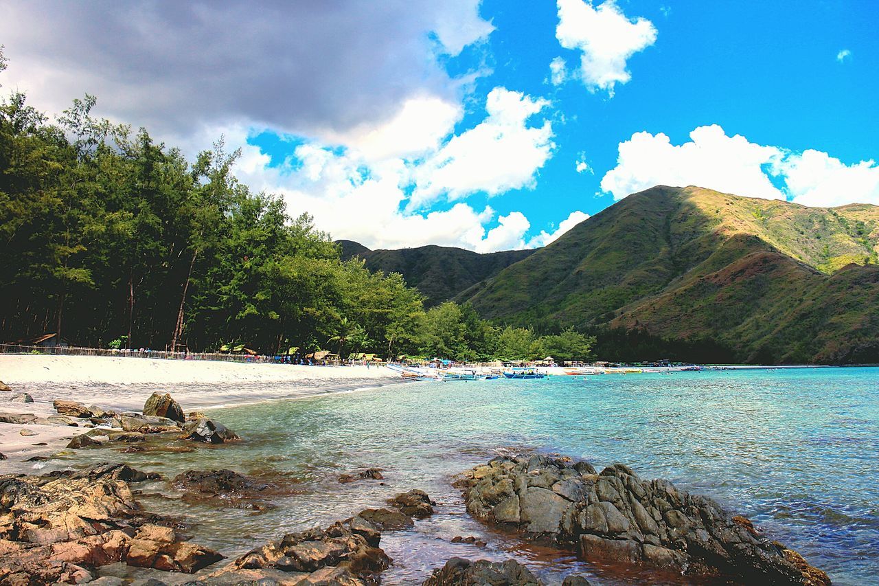 water, sky, nature, beauty in nature, scenics, tranquility, tree, outdoors, day, cloud - sky, tranquil scene, no people, mountain, vacations, swimming lane marker