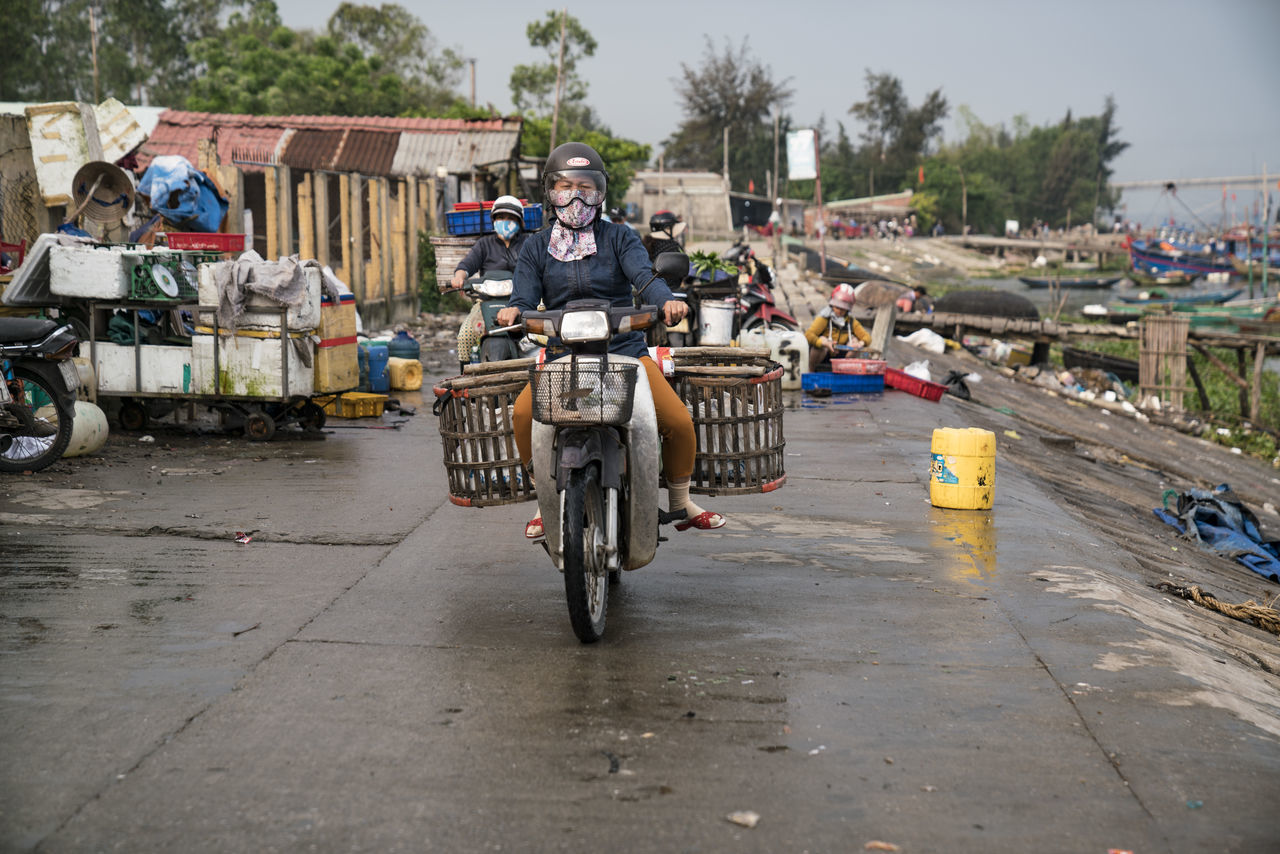 MAN RIDING BICYCLE ON STREET