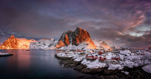 Scenic view of frozen lake against sky during sunset