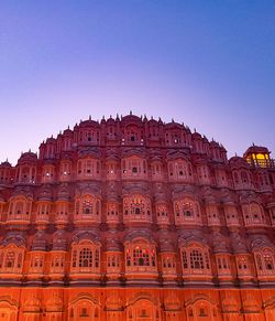 Low angle view of historical building against clear blue sky