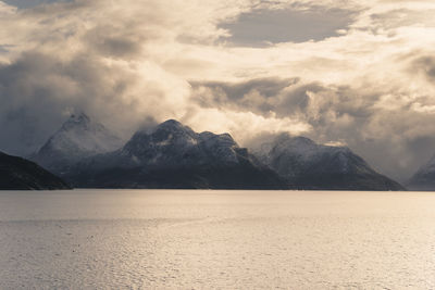 Scenic view of mountains against cloudy sky