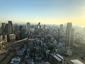 High angle view of buildings in city against sky