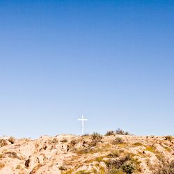 Scenic view of land against clear blue sky