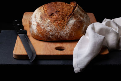 Close-up of bread on cutting board