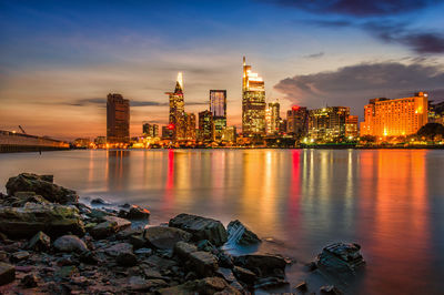 Illuminated city at waterfront